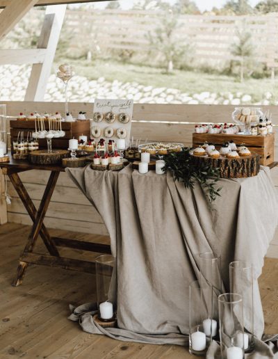 Beautiful candy bar decorated in beige and white colors